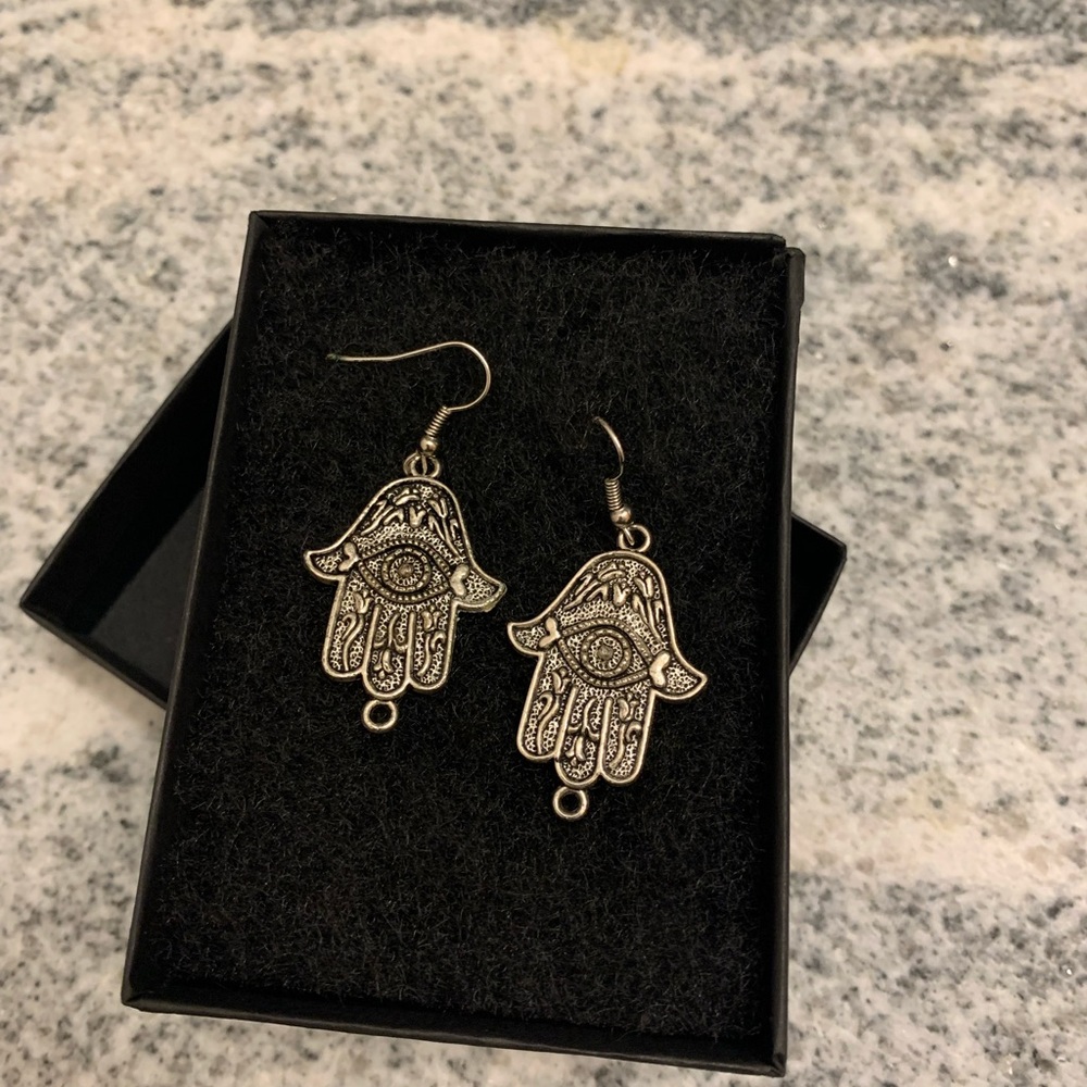 Large hamsa hands earrings. Silver tone for pierced ears.